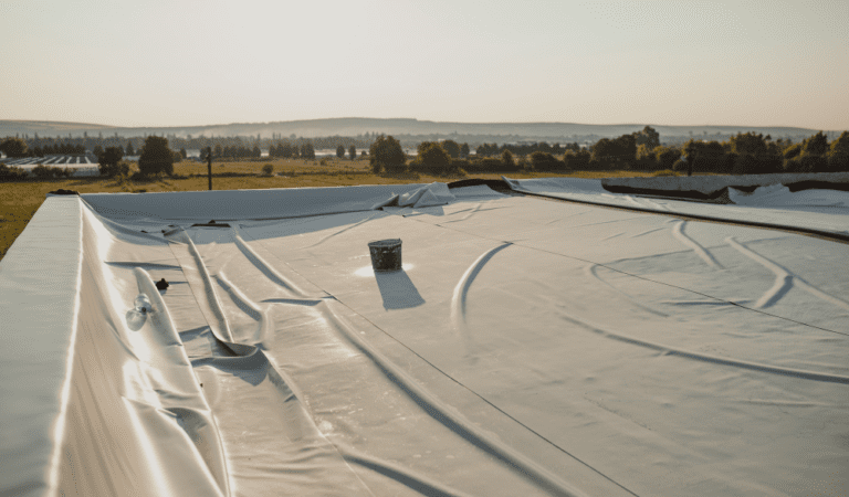 A large white tarp covering the roof of a building.