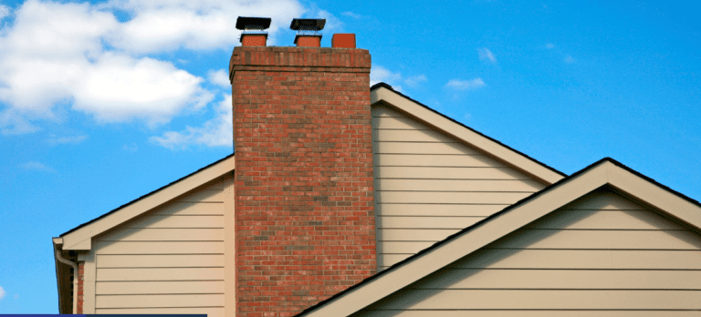 A brick chimney on the side of a house.