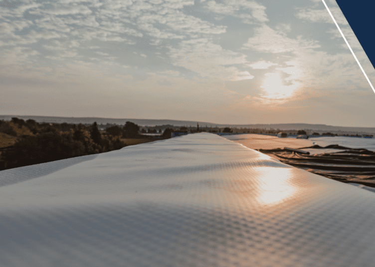 A view of the sun setting over a river.